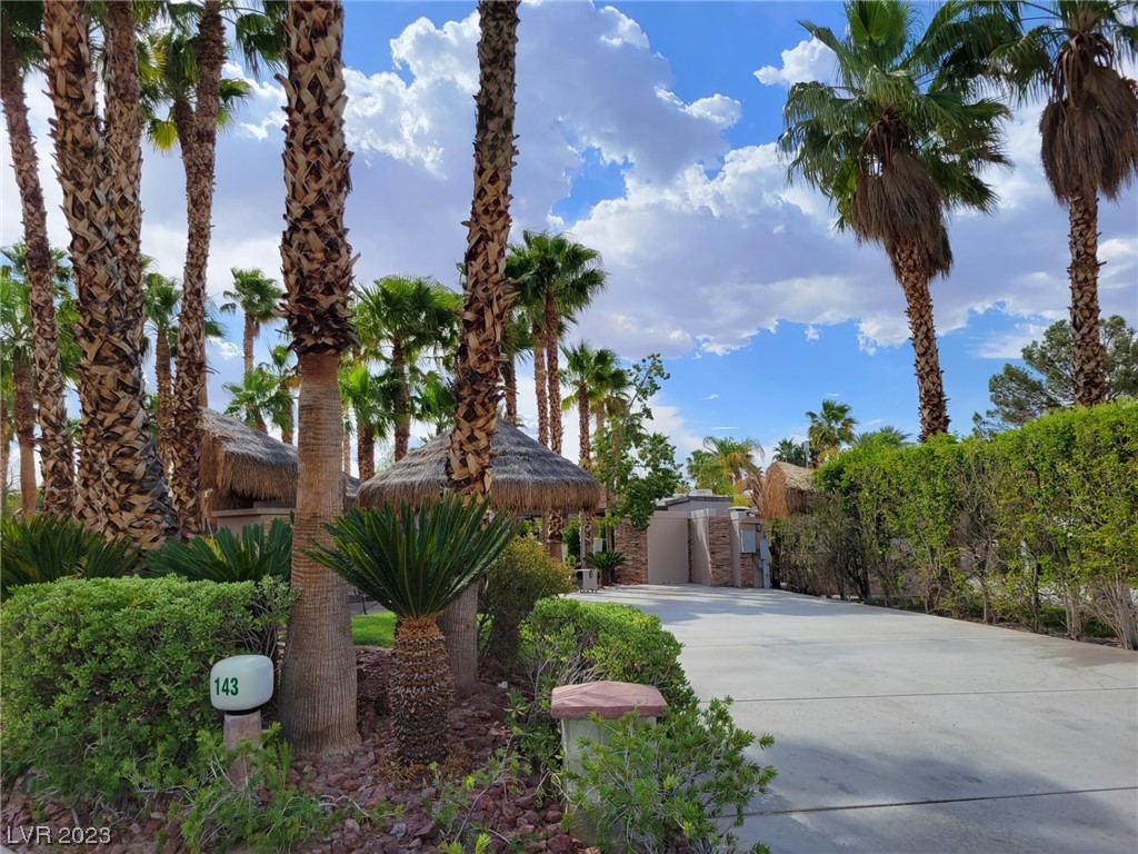 Located in the guard gated Las Vegas Motorcoach Resort, this huge corner lot located right across from one of the pools is spectacular!  This site features lush landscaping with plenty of privacy, palapas, dining table, living room area with fireplace, TV, and more!   This one won't last long!