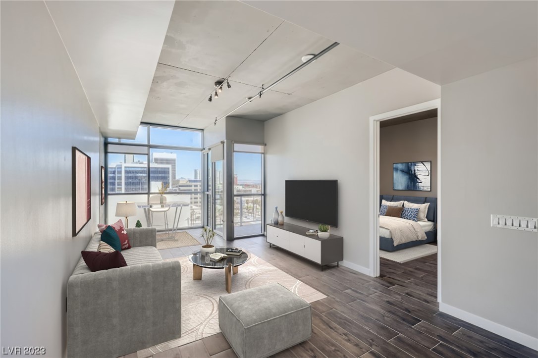 Call Listing Agent for Incentives - Remodeled! Beautiful Downtown LV loft-style 1 bed (ACTUAL BEDROOM), 1 bath, spacious open-plan, TOP FLOOR - 10ft ceilings, floor-to-ceiling windows, balcony overlooking the city, Nest thermostat, bright finishes, tile flooring, chef’s kitchen with stainless steel appliances, gas cooktop, custom backsplash, sleek cabinetry, & a breakfast bar that seamlessly connects to the living and dining areas. Perfect for entertaining. Separate primary bedroom offers flex space w/ ensuite shower/garden tub combo, new counters, double vanity, & a walk-in closet. Amenities abound in this building, including a resort-style pool, outdoor kitchen with 2 gas grills, cabanas, a 2-story fitness center, concierge services, vino deck, enclosed dog walk, assigned covered & gated parking. Juhl promenade at street level offers retail & restaurants, near Symphony Park, Arts District, Freemont Street, Transportation, and more making this a perfect location for Downtown LV living