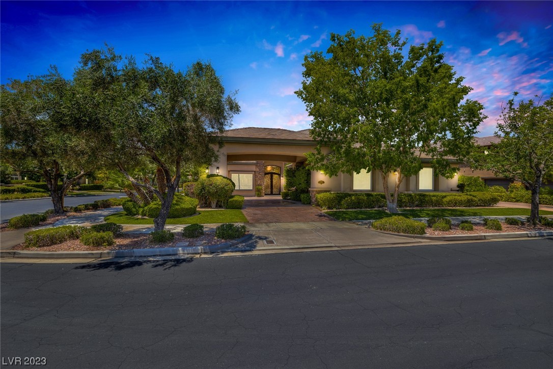 Welcome to this recently renovated custom home in the heart of Summerlin's guard-gated Willow Creek community. This luxury residence is on a corner lot with two driveways and a spacious garage.  The living spaces are expansive and stylish, with five bedrooms and seven bathrooms, including a stunning downstairs suite. The main floor showcases a magnificent kitchen that seamlessly opens to the beautiful garden, providing ample counter space for all your culinary needs. Other notable features of this home include two laundry rooms, a loft area, and a convenient extra space with a private entrance that could be used as a workshop, craft room, or dedicated space for your pets. Step outside into the private backyard with a serene atmosphere, an outdoor cooking area, and a refreshing pool. This remarkable property is conveniently located near Downtown Summerlin, the Golden Knights arena, and the Red Rock Casino, ensuring endless entertainment possibilities.