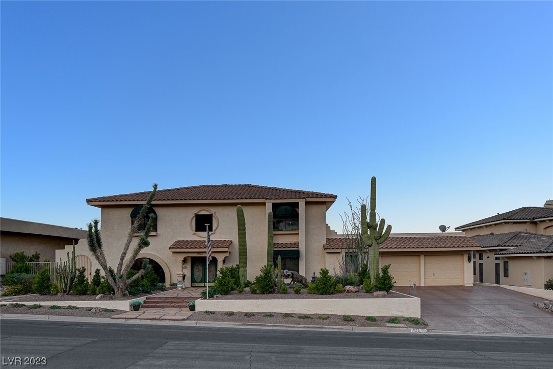 Beautiful custom home with views of Lake Mead and  Fortification Hill! Enjoy the scenario from your relaxing infinity pool or your above ground spa. Plenty of room for friends and family in this 6 bedroom beauty. Five bedrooms downstairs, including a separated  primary suite. Home has elevator and great room with bar. Home has a total of 2  gas  fireplaces. Large windows throughout bring the outside in! Home has solar panels. Pool is solar heated in addition pool heater. This beautiful home is priced right and won't last long!