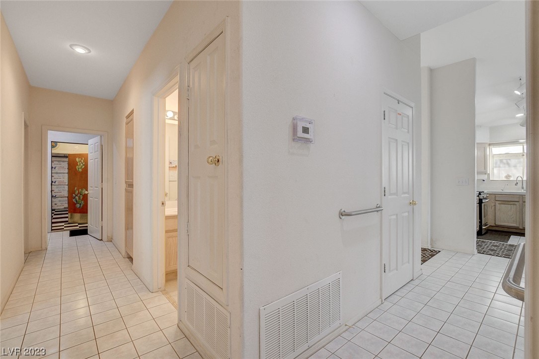 Hallway to additional bedrooms and baths