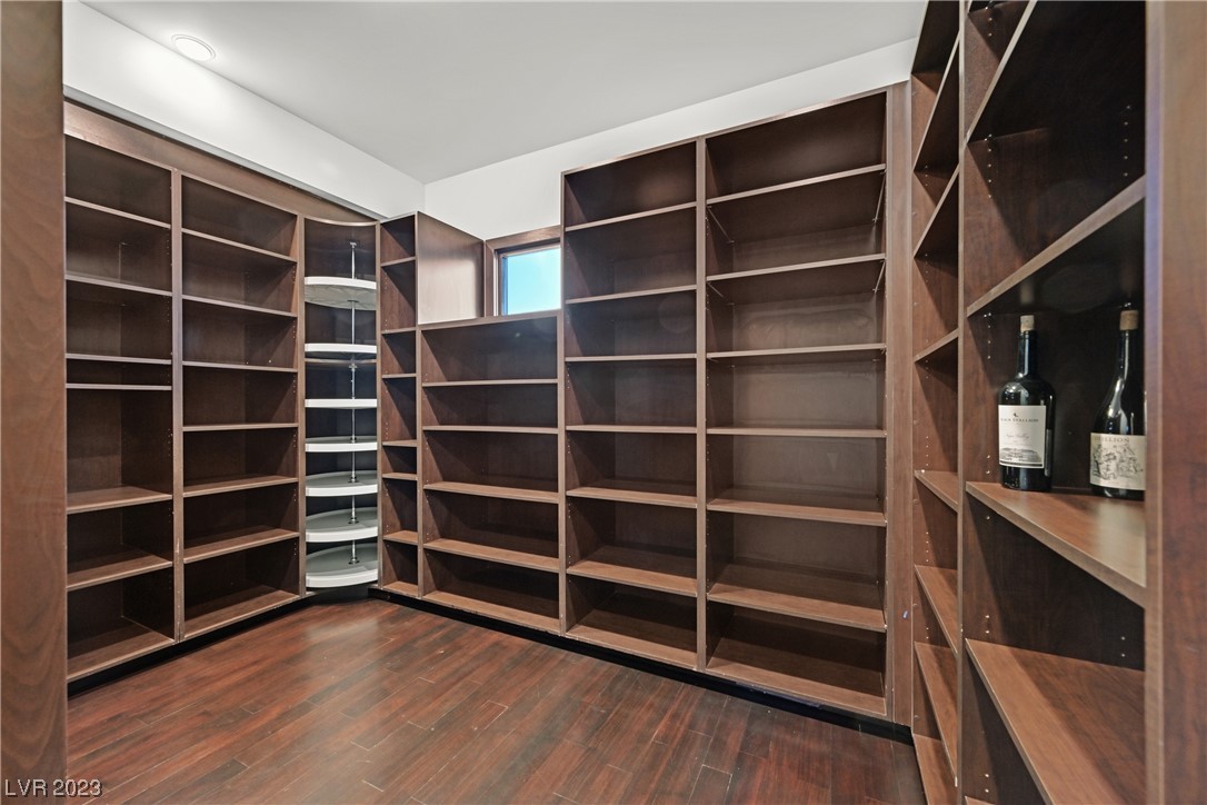 Large, walk-in, custom pantry with amble shelving and storage.