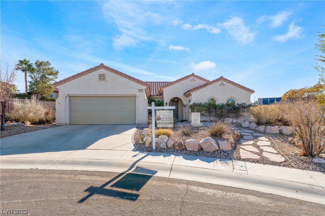 ***** .36 of a acre. 16,682 Sq. Ft Lot *** Your new home awaits you at this Sun City Anthem ranch. Turn-key Jackson model is located on a quiet cul-de-sac, Oversized Elevated quarter+ acre. Open-concept living w/ large master bedroom, 2-bathrooms, dual vanity & Sunbay tub in Master BA, & 2-car garage. New custom blinds; barrier-free hardware. Kitchen has new SS refrigerator, built-in stove, disposal, & microwave. Floors are clad in lovely diamond pattern, sepia Italian stone/travertine reminiscent of LA’s famous Getty museum; celebrating both permanence, warmth, simplicity and craftsmanship. Desert landscaping with stone paths, irrigation systems, shrubs & EZCare mature fruit trees. Sun City (55+) Anthem offers–multiple swimming pools, spas, exercise center, indoor walking track, tennis & pickleball courts &more. Solera Community Center hosts year-round activities in their billiards, arts&crafts, theatre, computer lab, and ceramics’ rooms. Steps to 36-hole Revere Golf Course.