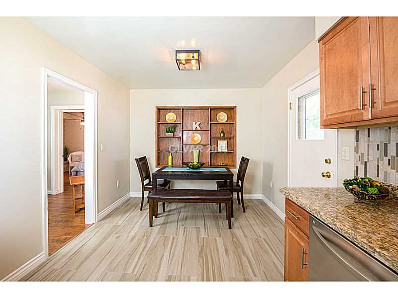 Dining Room. Dining room overlooks the beautiful kitchen & offers custom built-in shelving.