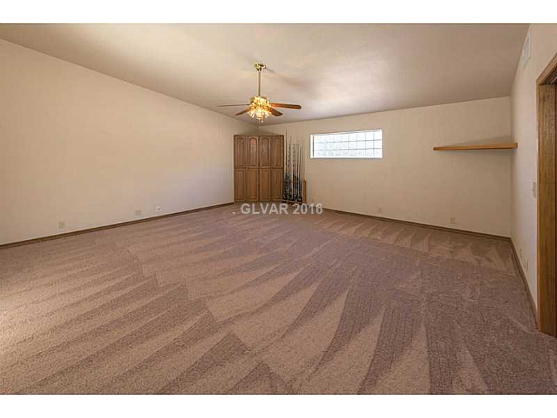 Den. Huge den/bonus room with many possibilities for its use, and direct access to backyard.