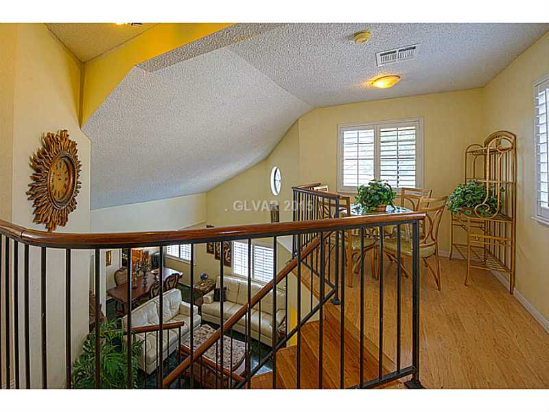 Loft. Custom stair banisters offers a dramatic WOW factor!