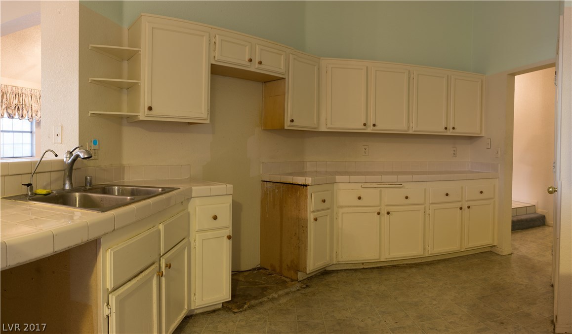 Kitchen has many cabinets and does have a pantry.  No appliances are included.