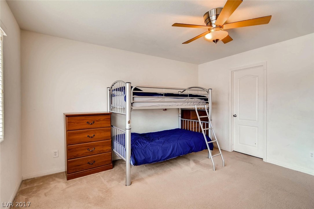 An upstairs bedroom, big enough for several bed sets; a reading nook; study area; play area.  The room is 12x15, so it's big enough for a king bed.