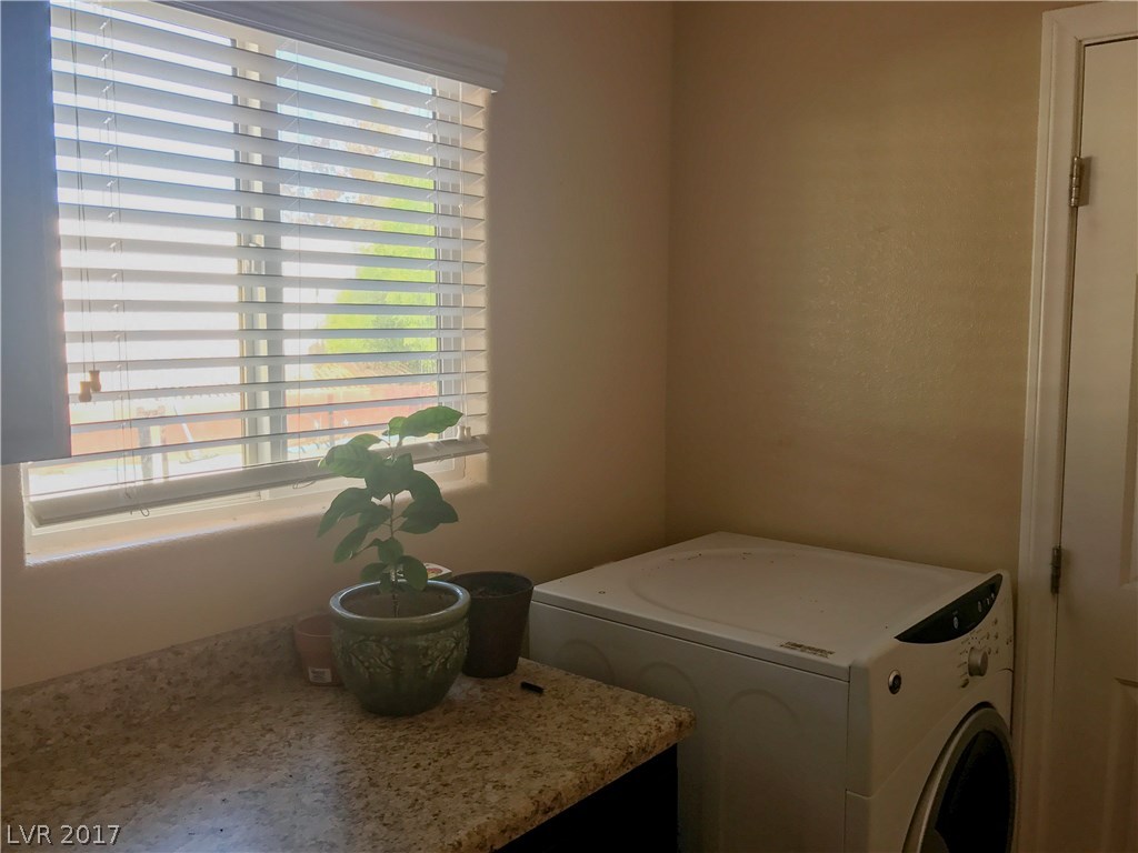 Laundry room has a folding counter.  Washer & dryer are included.