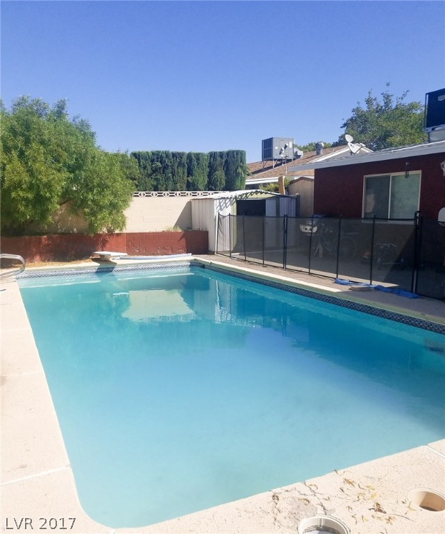 Diving board for summer fun in this large pool!  Fencing around for the safety of chidren and your fur-babies.  Storage shed for pool floaties etc.