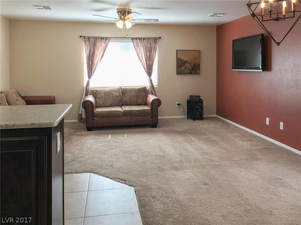 Plenty of room for the family to enjoy the living room, open to the kitchen and dining.  Easy access to the pool.  And don't forget the huge Bonus Family Room, at the end of these photos.