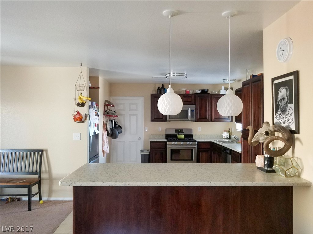 Spacious kitchen; recessed fridge.  Breakfast bar was added during remodel.