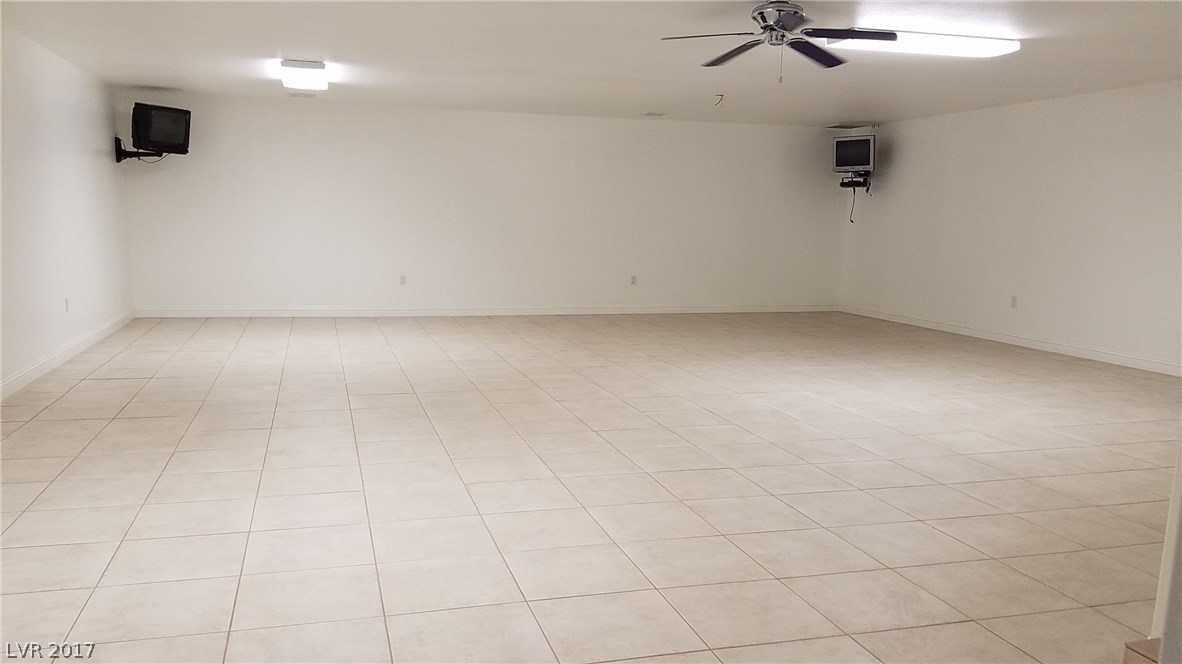 Here's a basement family room that can host a huge party!!  TVs are included!