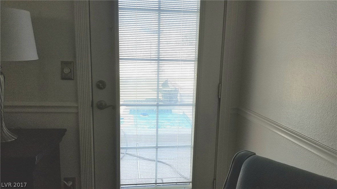 Door to pool and spa.  Blinds are between the two sheets of glass, so you do not have to dust them!  Lever on edge of trim controls the angle of the blinds.  Sweet!