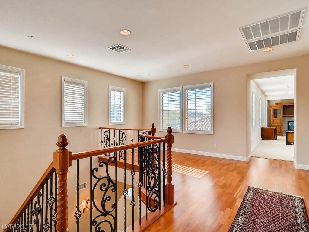 Spacious landing good for reception area, piano, library, or other uses.  Beautiful hardwood floor and recessed lights.