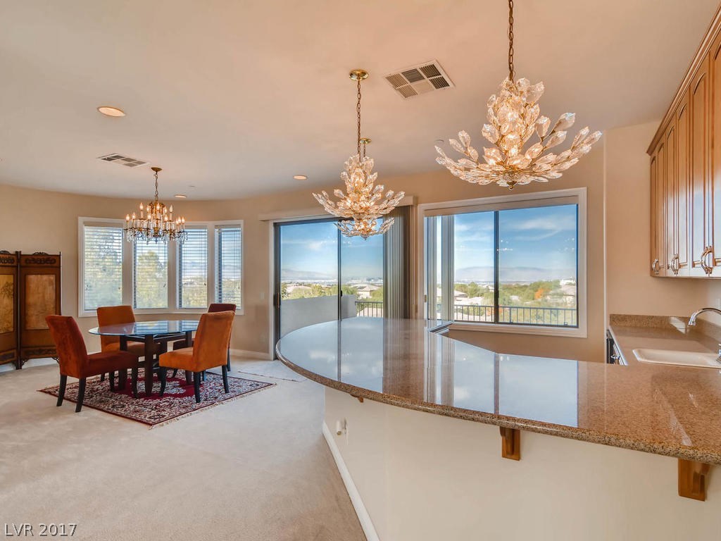 Plenty of room for dining at a large table, or at the expansive bar, with sink and under-counter refrigerator.  The views go on to the mountains, the valley, the Strip and beyond.  It's really a bird's eye view!