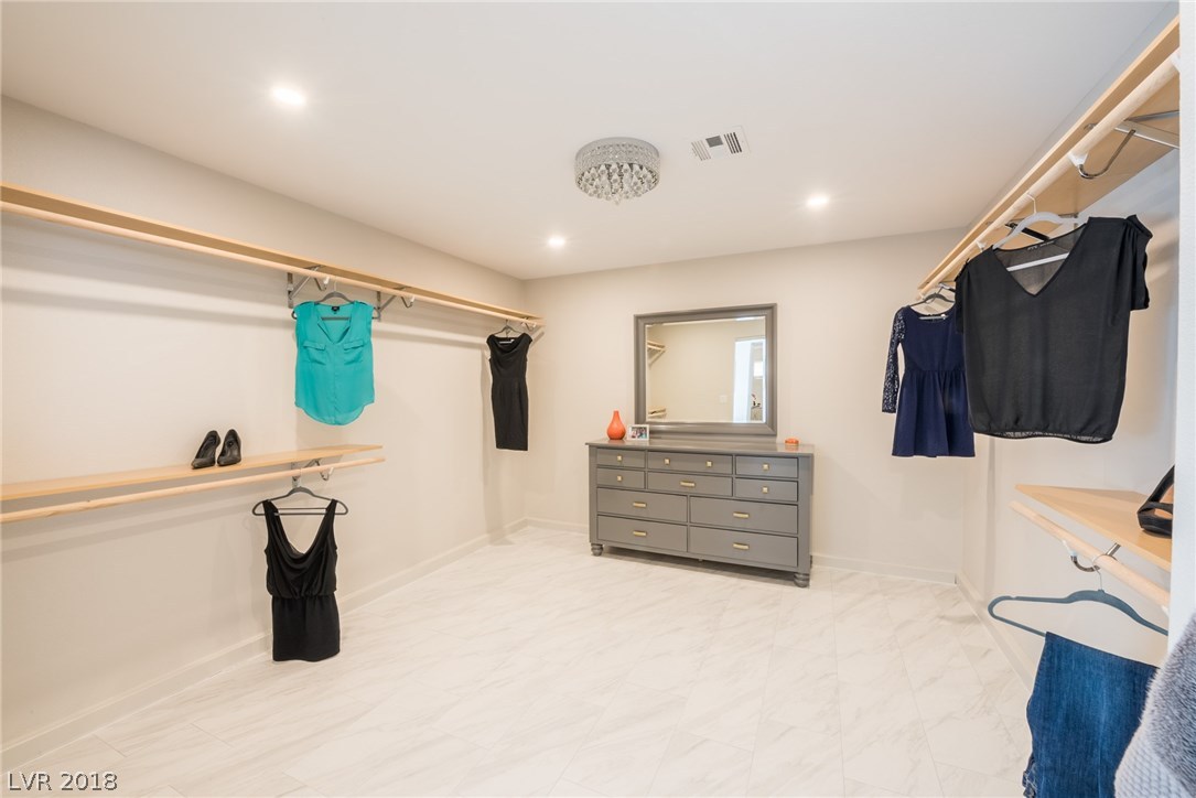 Your master closet is large enough for all your storage & clothing needs.  A custom chandelier, gorgeous tile floors, all new clothing rods.  Enough space for all your customizing needs.