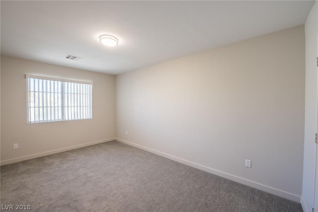 Large secondary bedrooms upstairs all offer luxury carpeting & padding, plus walk-in closets, ceiling lighting & natural light from the windows.