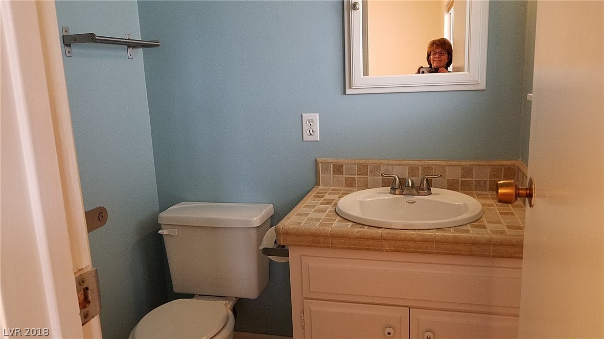 The original master bathroom has been updated!  Compact room with a large shower and a window to the back.