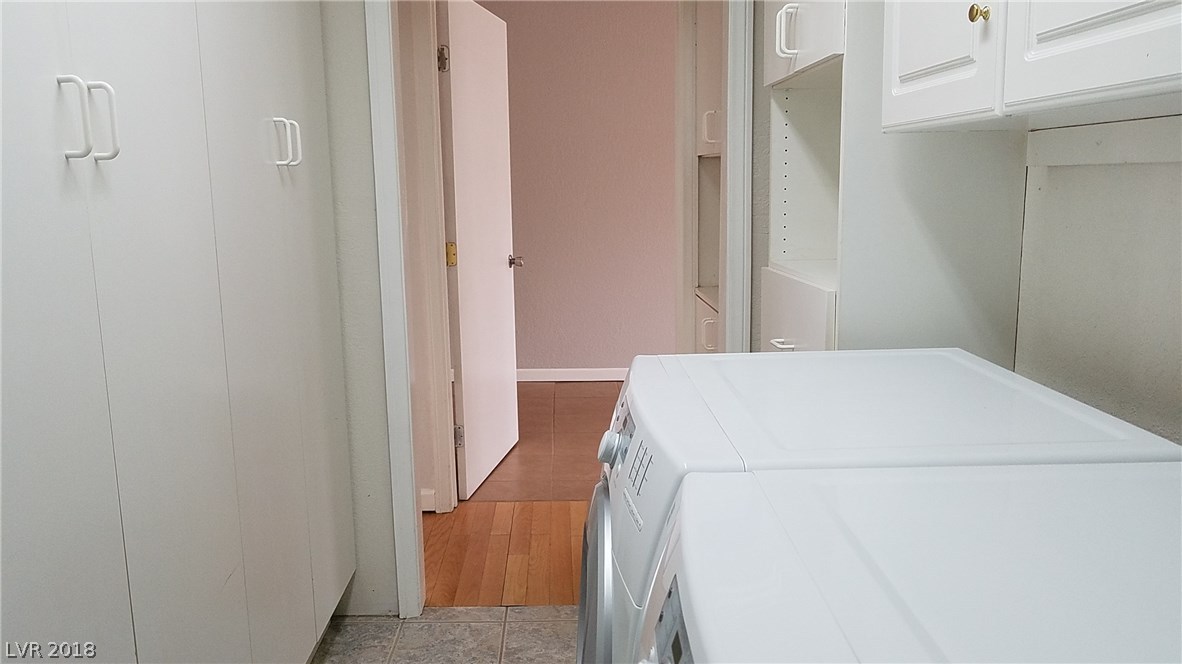 Here is a big laundry room, 10 feet long and 6 feet wide!  Cupboards and closets abound.  Front-loading washer and gas dryer are included!
