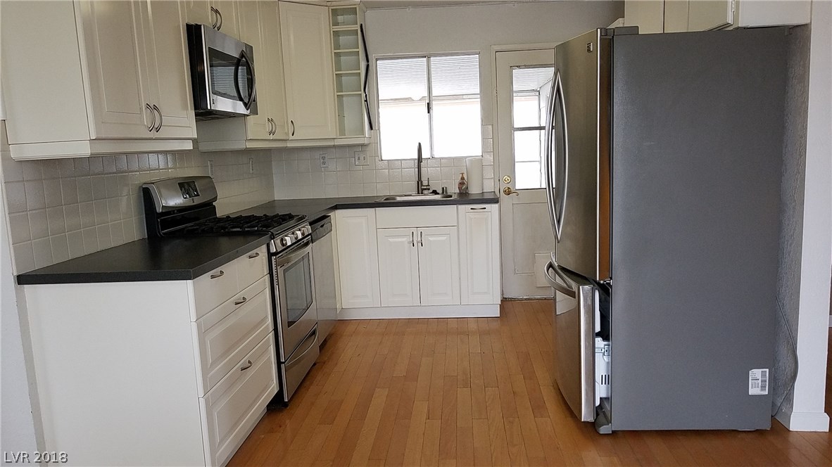 Enjoy this streamlined kitchen with some modern surprises!  Door leads to covered, screened in patio.  All appliances are included!