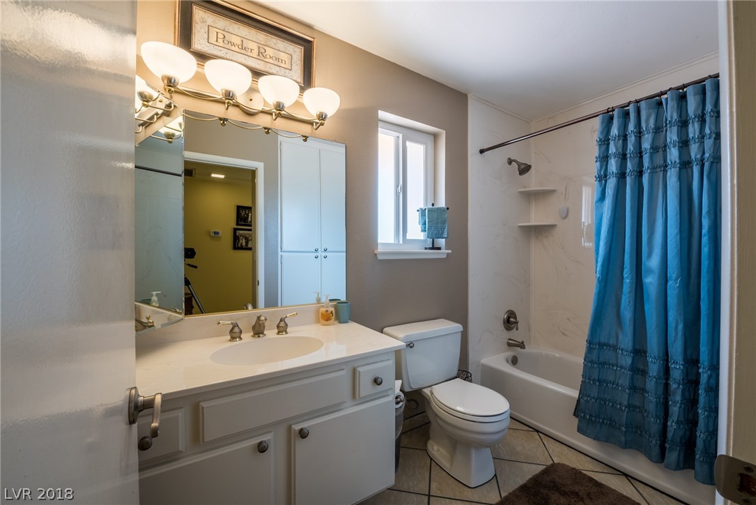 Hallway bathroom upstairs has been updated and offers a large vanity, newer toilet, newer counter tops, newer light fixture, and upgraded tub/shower combo.  There's also a window that opens to allow fresh air & natural light, along with tile floors & neutral paint colors.