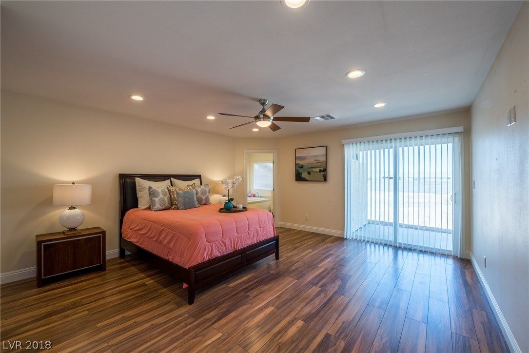 Master bedroom is located at the rear of the home and offers gorgeous laminate wood floors plus your own slider for access to the backyard.