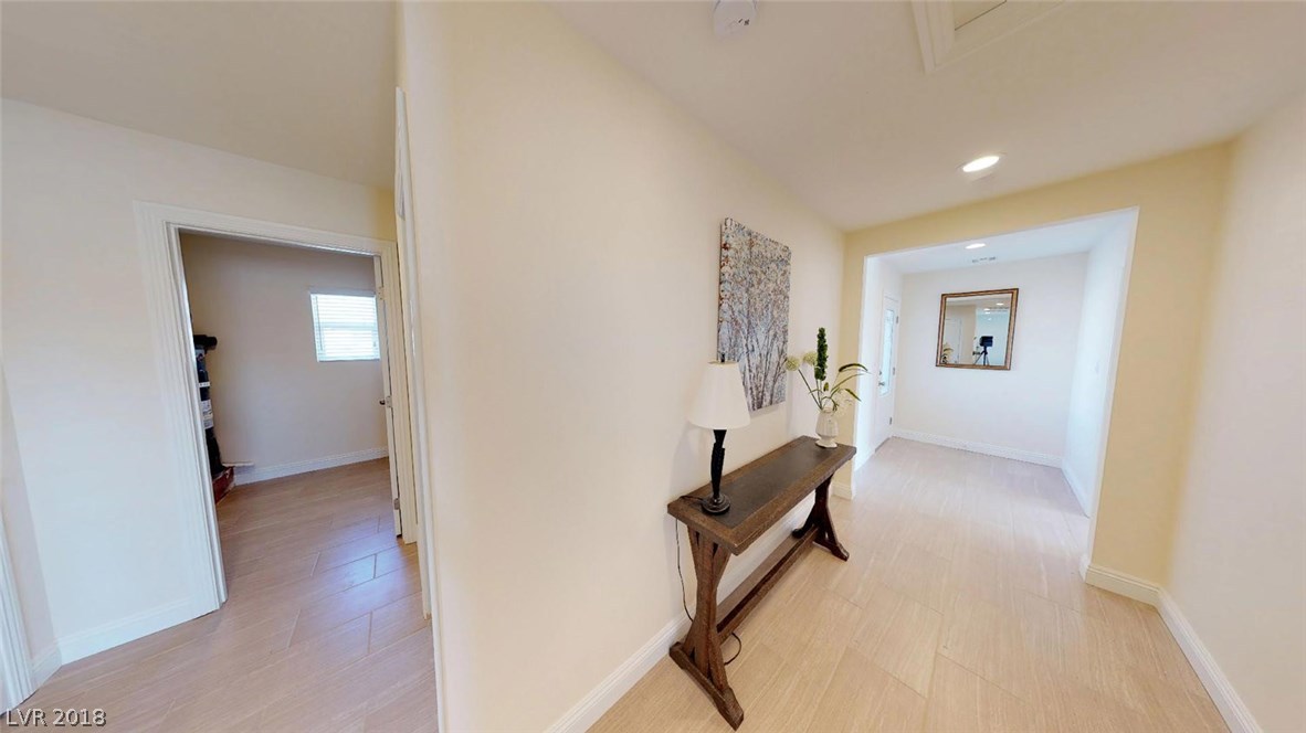 Extra large hallway offers 2 closets, laundry room, and plenty of space to move around in.