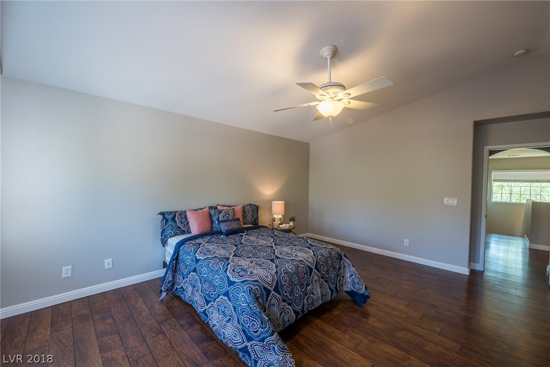 This master bedroom has tons of space for all your furniture & storage needs.