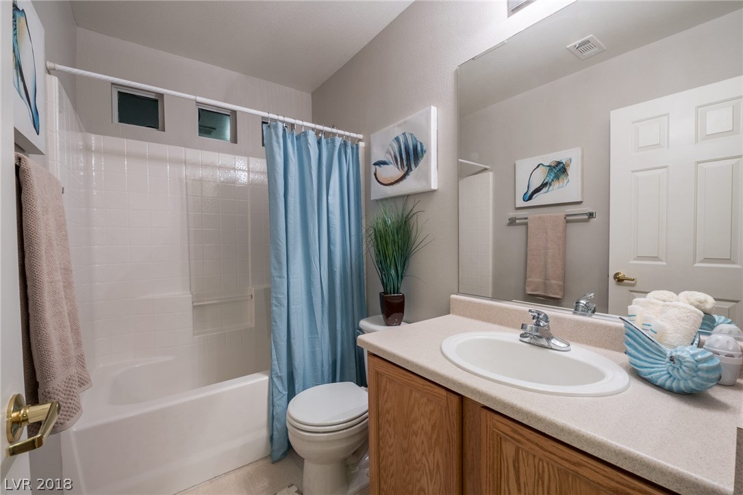 Hallway bathroom upstairs offers you a tub/shower combo, plus sink & vanity.  Small windows above the shower allow for just enough natural light to come in.