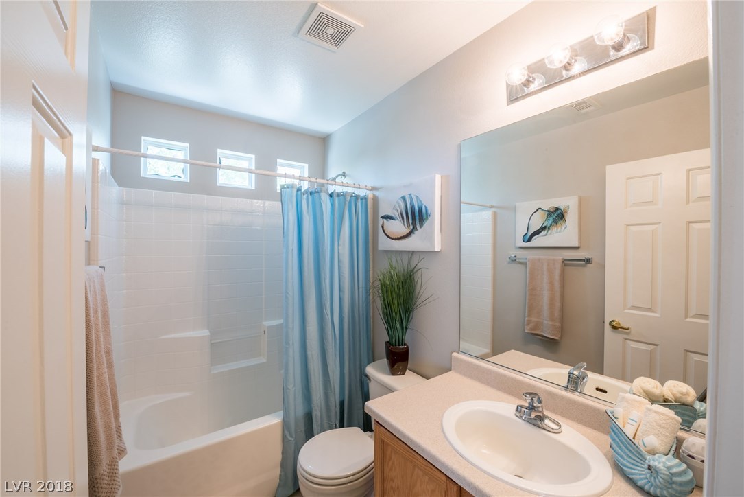 Hallway bathroom upstairs offers you a tub/shower combo, plus sink & vanity.  Small windows above the shower allow for just enough natural light to come in.