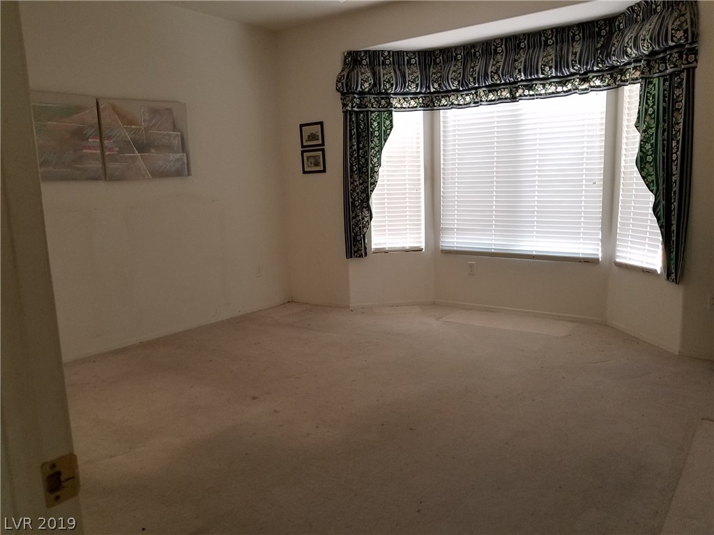 Spacious master bedroom with bay window for extra table or dresser.
