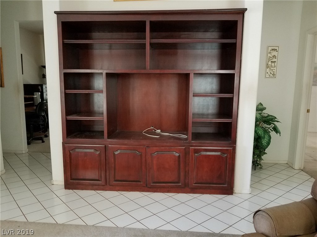 Huge custom cabinet for TV, books etc, in living room.