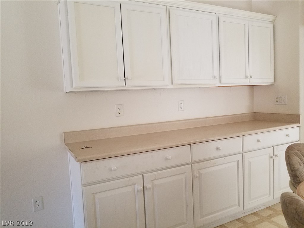 Upgrade of extra cabinets and counter space at edge of kitchen.  So appreciated!