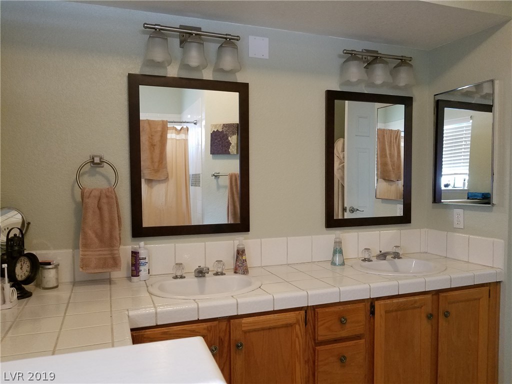 New mirrors and light fixtures in the master bathroom.