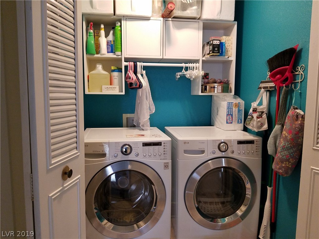 Updated laundry area ! Fresh paint and new cabinets.  It's deep enough to stand inside to reach the cabinets.  Good organization in this house!