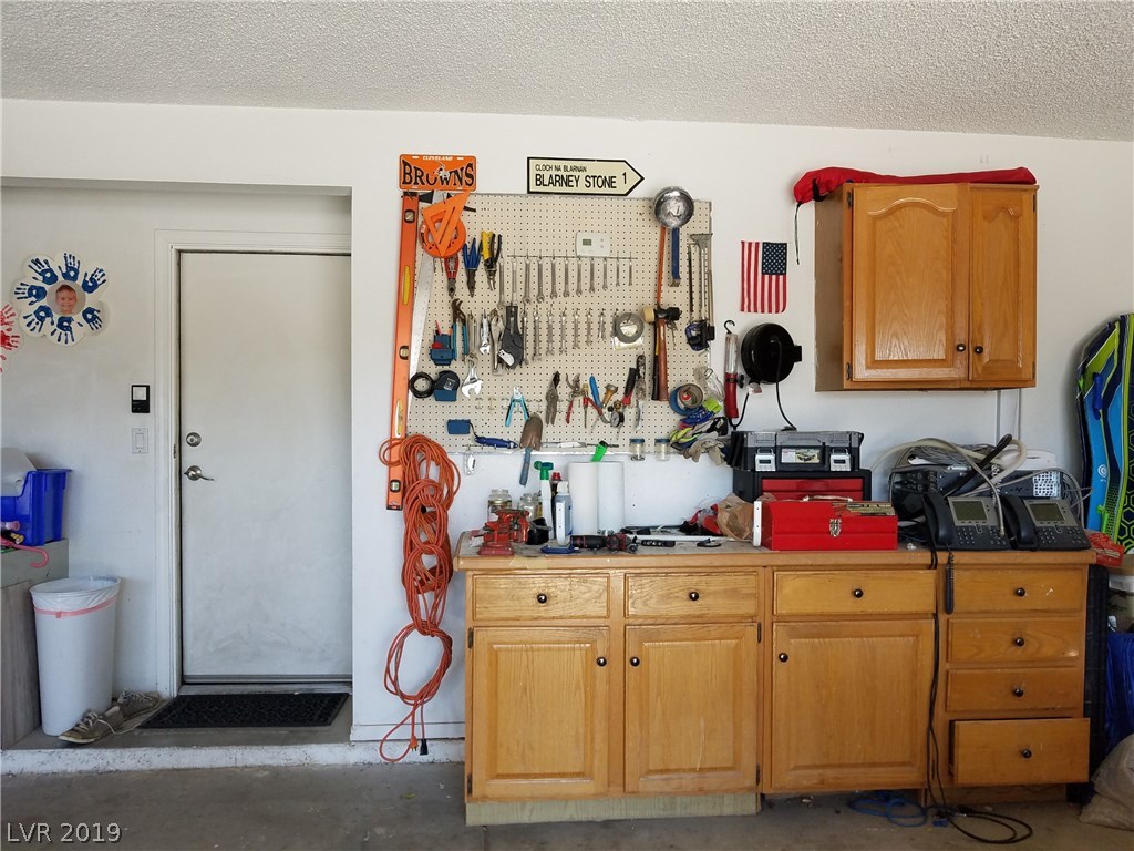Workbench and cabinets make the garage a great space to tackle projects or do repairs.