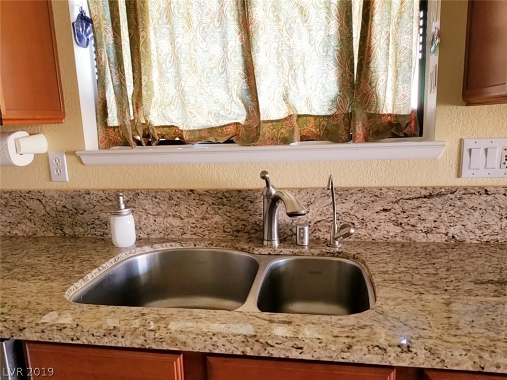 Good quality, deep stainless steel sink with garbage disposal on right.