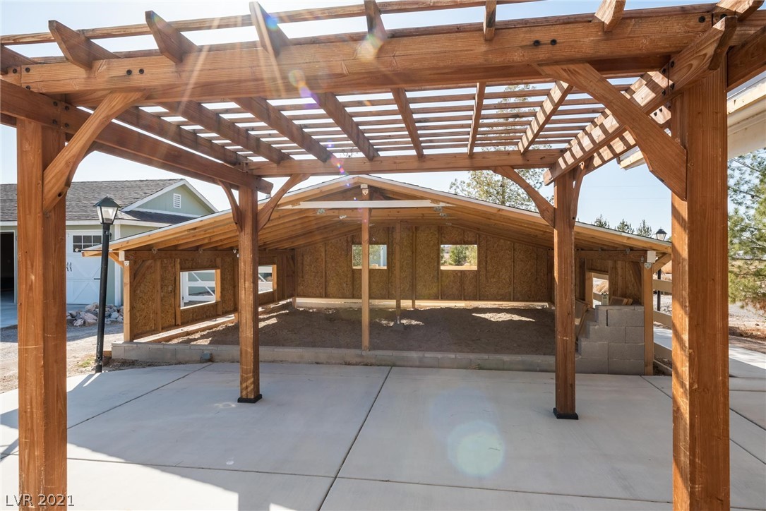 Recently built covered area can serve multiple purposes for animals, children's play area, storage, or covered sitting area.