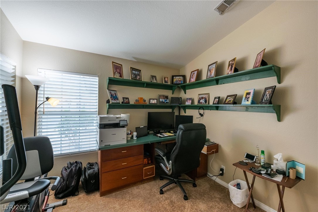 2nd bedroom currently used as office. Desk & shelves  convey with the sale.