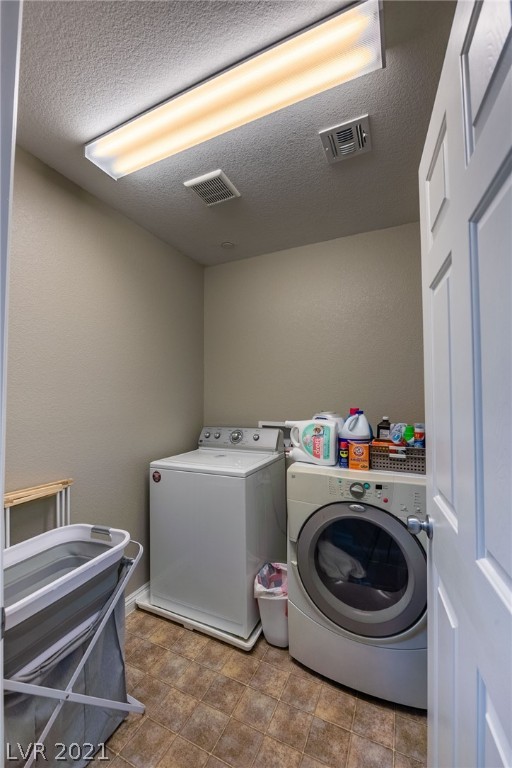 Large laundry room located upstairs.