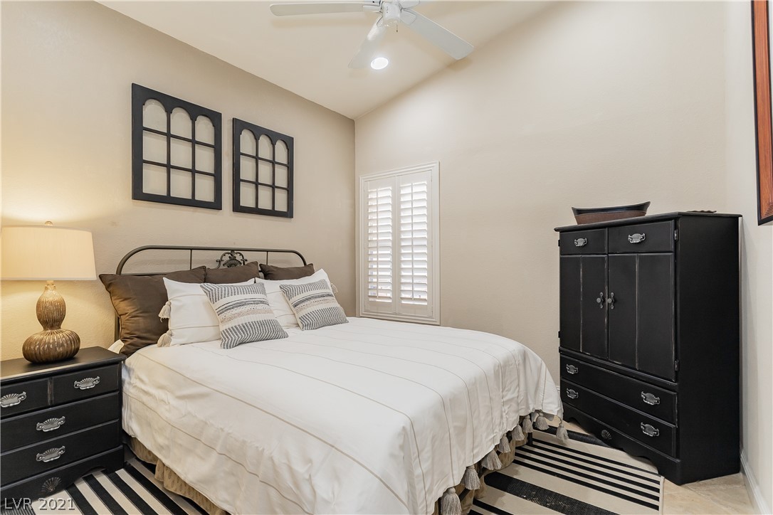 Nice size secondary bedroom with wall closet; pot shelves & ceiling fan