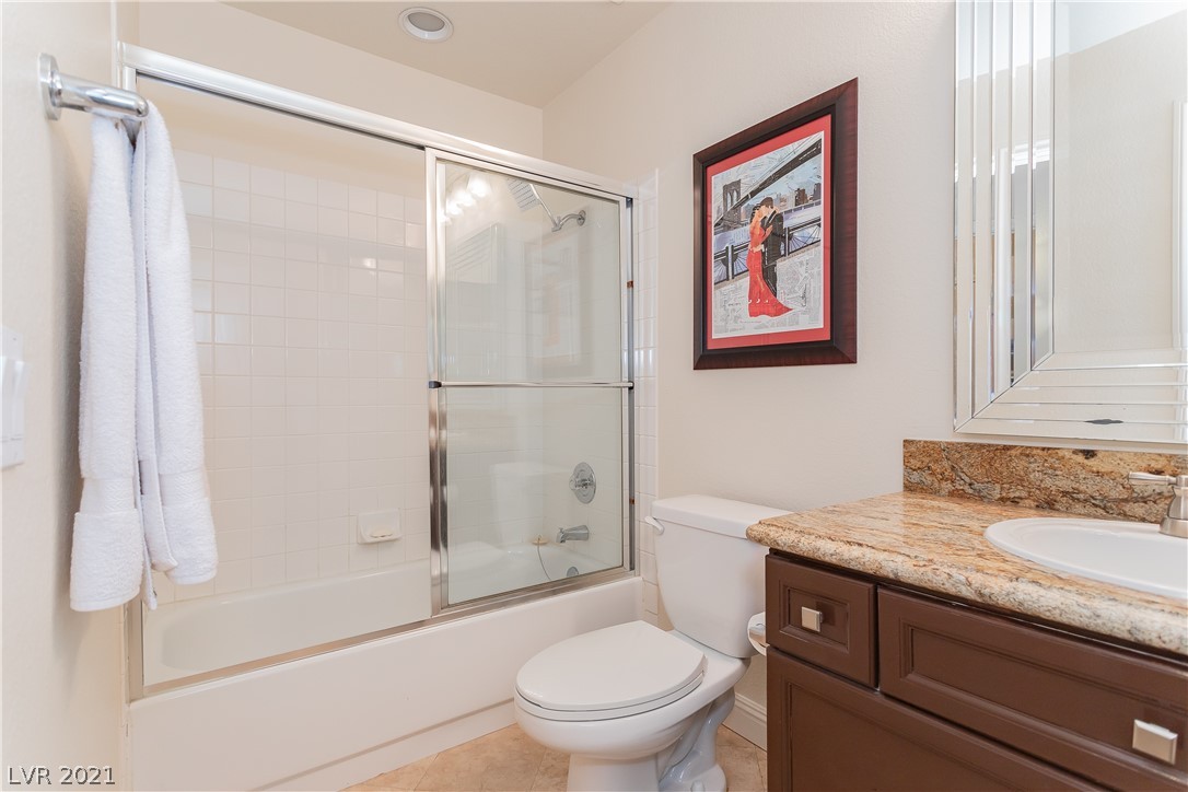 Full hall bath with newer vanity & granite top; sink & plumbing fixture.