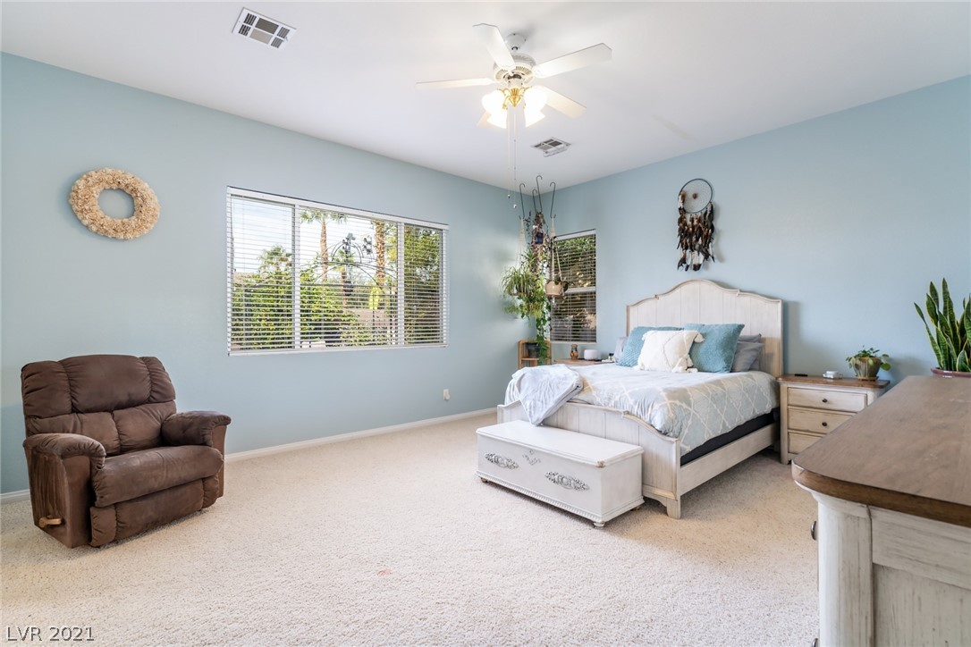 HUGE PRIMARY BEDROOM WITH CEILING FAN AND MORE VIEWS TO THE BACKYARD GREENERY