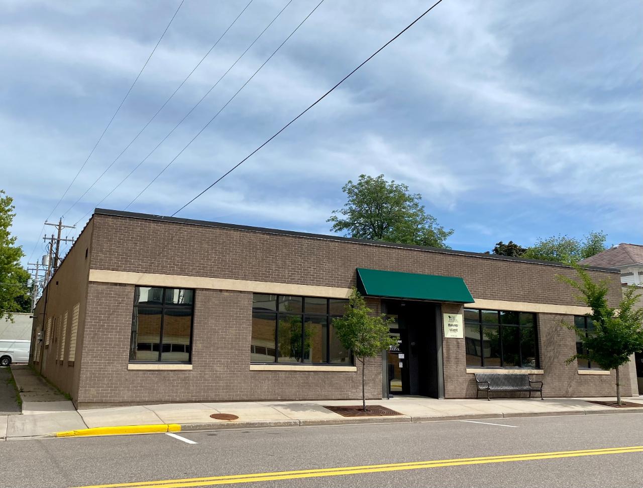 This updated commercial office building in Downtown Rhinelander has 7000 sq. ft. of office space, & of heated garage space & storage, and abuts an alley & city parking lot. The vestibule area makes this office area easily dividable to 3 to 4 different businesses. The heated back garage area has an overhead door, & multiple other entrances for deliveries & heated storage space & a restroom (not currently used) There are two conference rooms with windows, a few large workspace areas, several offices, (13 + rooms) men’s and ladies restrooms, & a break room. The possibilities are here for a day care, insurance office, large arcade, resale shop, ……. Several options for an investor to explore. Set up your appointment today.