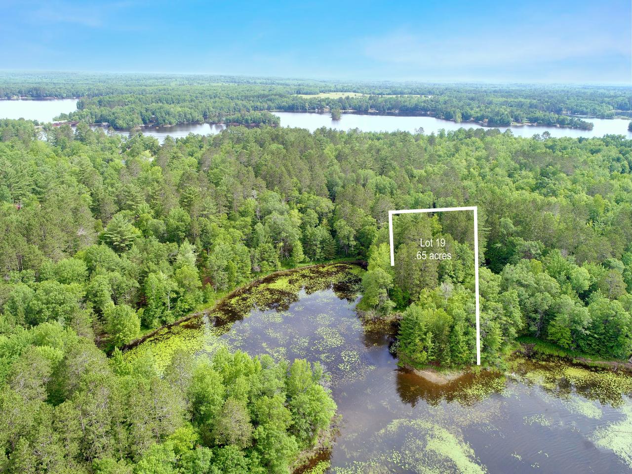 Enjoy the quiet privacy of a dead end road and 266’ of frontage on Deer Lake. This lot has .65 acres of towering pines and hardwoods, perfect for your Northwoods dream home. Established trails run through the property with many great clearings started for the building process. Deer Lake is a 150 acre full rec lake with a max depth of 62 ft. In additional, gain access to Lake Nokomis and Bridge Lake through a small channel when water levels are up. Great location being close enough to many restaurants, shopping and other necessities. Natural gas and electric available at the road. All lots are marked with a sign and pink ribbon.