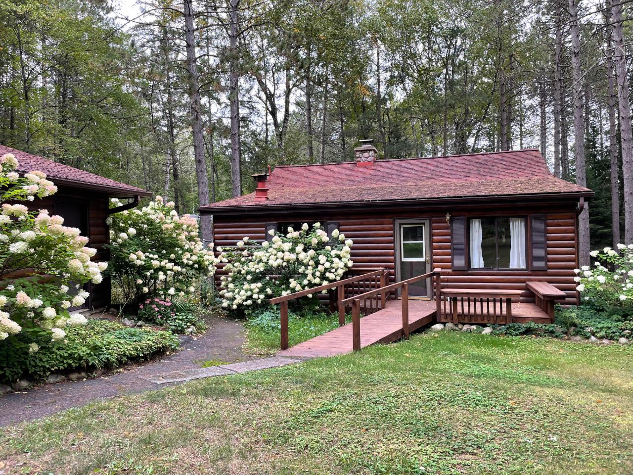 Don’t miss this 3 for 1 special! Nestled on the quiet bay of Rest Lake lies a quaint year-round cabin on 3 beautiful, wooded lots. This 2 BR 1 BA cabin is sure to turn into your favorite seasonal getaway or a quiet residence to permanently relocate to. A gorgeous lake view can be seen from the open concept living & dining room or w/a wintertime fire warming as you stare out at the sparkling snow. Sit back with a book & your favorite beverage in the “she shed” and enjoy not only the lake view, but the abundance of wildlife that cross through the yard! The home features a detached garage next to the home as well as a large pole barn garage for your toys including the pontoon boat & snowmobile that are being sold with the home! A small boat cruise around the corner leads you to the beautiful MW chain. The bike trail goes right across your driveway connecting you to the entire paved bike trail system of Vilas County. Must see to appreciate! Pole Building 30'x38' "She Shed" 14'x10'
