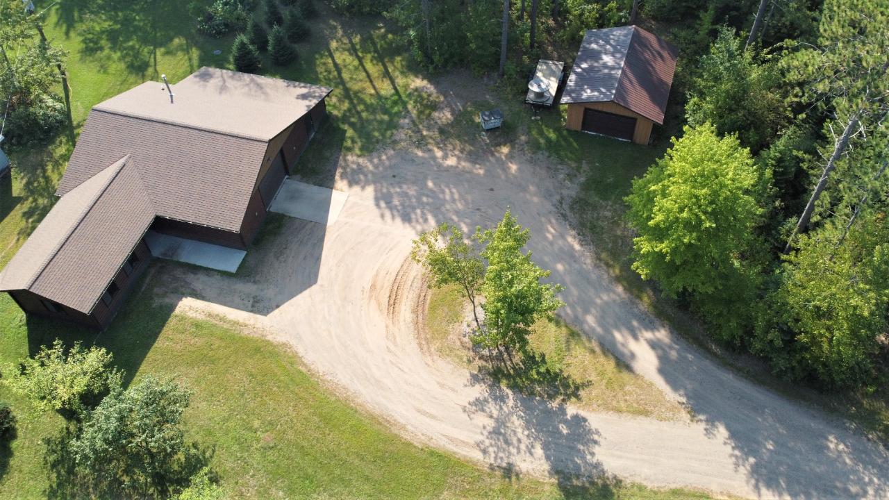 Prime Location Property! This commercial property consists of 4.5 acres with an office, attached heated garage and detached garage. Zoned General Use to be able to build a home if the buyer so chooses to . On the ATV/UTV and Snowmobile trails. Close to all the recreational activities a person would like in the Northwoods. Call today to schedule a a showing. Dimensions are approximate, Buyer to verify all data.