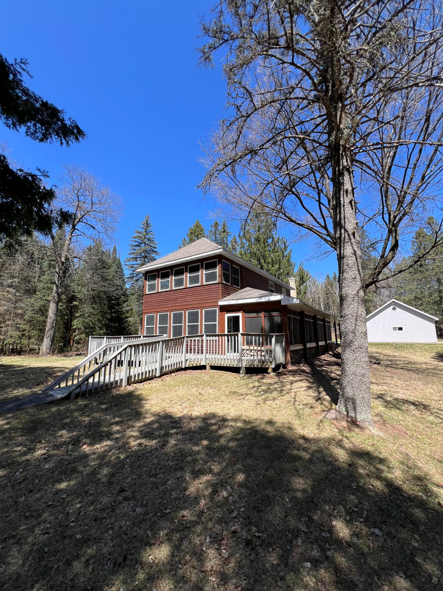 Whether you are searching for lake house or a new home, this property is the one for you! This 2,000 square foot house sits on a 2.33+/- acre lot with 140+/- feet of frontage on Summit Lake! The main level features a large living room with vaulted ceilings and a brick fireplace, 2 bedrooms, 2 full bathrooms, a large remodeled kitchen with all appliances included, dining room, and a lakeside den with a screened, 3 season porch attached. The second level of the home features a bedroom with a screened, 3 season porch, full bathroom, large walk through bedroom, and a loft overlooking the living room. Conventional septic less than 2 years old. The 2 furnaces, 2 water heaters, and 2 AC units are new as well. The 3+ car, detached garage provides plenty of space to store toys and vehicles alike! Picture yourself enjoying a cup of joe or a frosty beer next to the lake, then call to schedule a showing! Buyer to verify all measurements