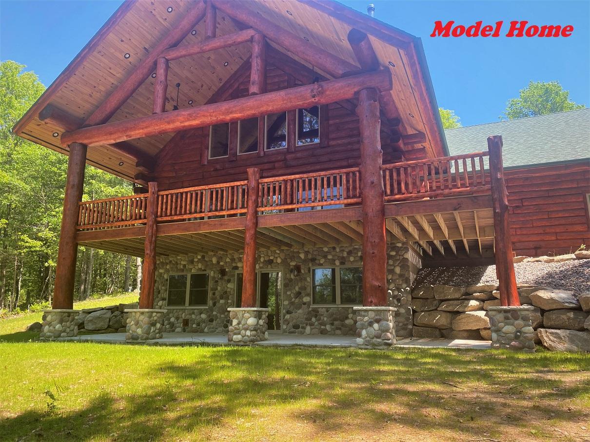 RHINELANDER CHAIN NEW CONSTRUCTION! Picturesque hand-hewn, log sided home set on 1 acres w/ 104.95 feet of waterfront on the Rhinelander Chain of Lakes! Over 1372 acres of water to boat & fish, or cruise to a restaurant on this is a perfect body of water no matter what your interests. Big water views through a wall of windows, covered main level deck & covered lower-level walkout give you the ultimate access to the water from almost every level. Nicely wooded lot offers good privacy as part of the Birchwood Shores North Condominiums. This small condominium development maintains the true "Northwoods Feel" w/ minimal HOA fees for road & common element maintenance. Located on a no thru road the driveway is off a Cul-de-Sac private road. This executive home offers 3 bedrooms, 2.5 bathrooms, including the master suite w/ a large walk-in closet & many other unique custom upgrades. This home is under construction at the time of listing. Unit 1 (1.9A w/ 109ft) available for additional $100K. Lower level stubbed in for 4th full bathroom. Home under construction. HOA fee $250/unit. Unit 1 available for $100,000 w/109 ft. of frontage, 1.09 A.